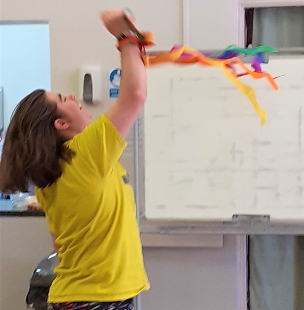 Talkback member dancing with ribbons