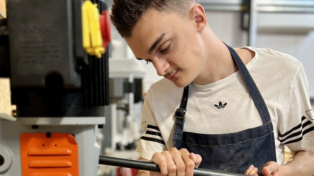 A young adult working in the Accessible Workshop, part of the Post 16 Specialist Provision.